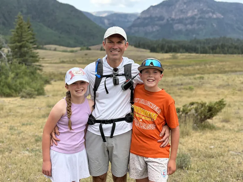 Joshua Downey on a mountain hike with his two kids