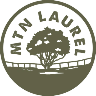 The Mountain Laurel logo at Comal Inn